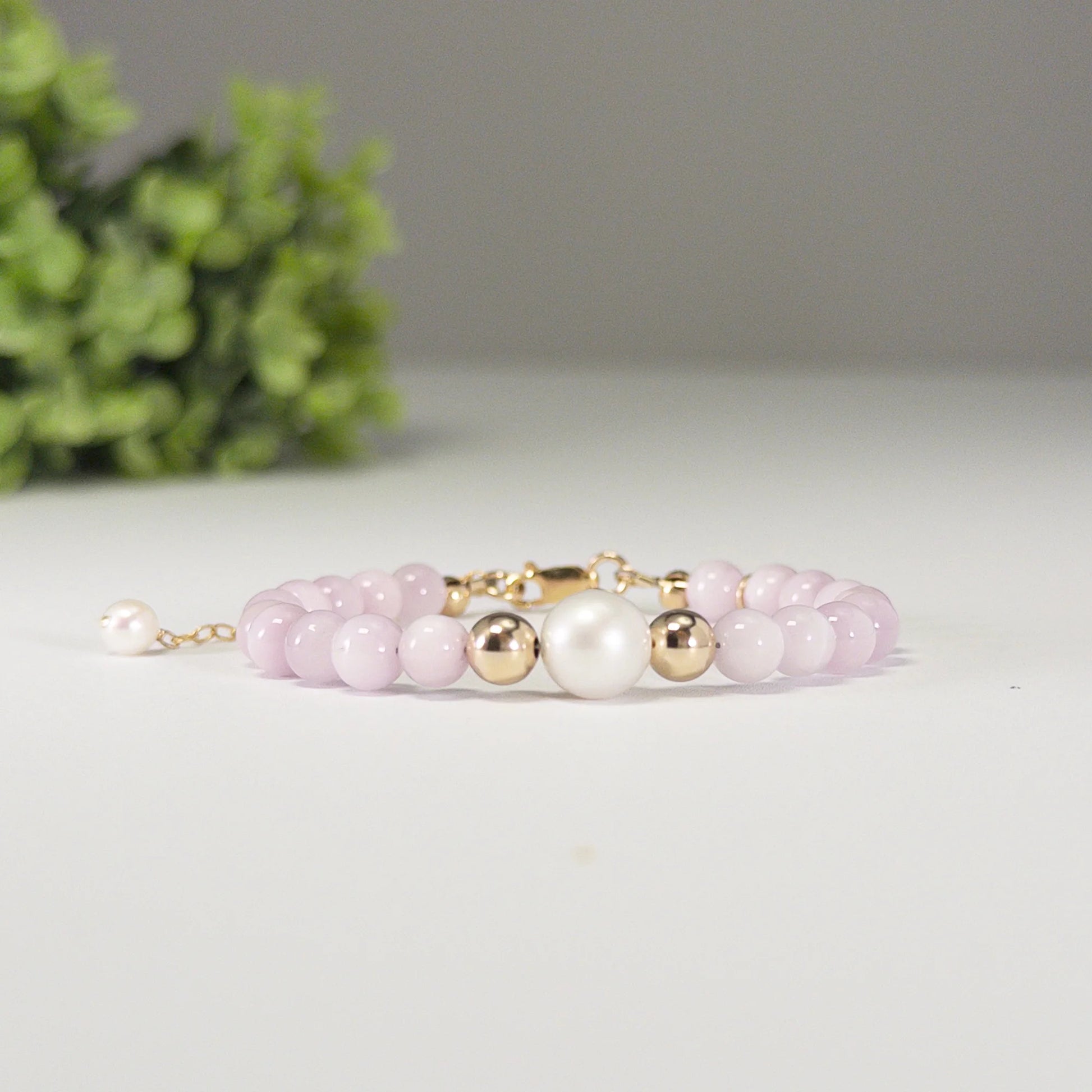 Kunzite, pearl and initial gold bracelet featuring translucent violet kunzite beads, lustrous freshwater pearls and a personalised gold-filled stamped initial disc.