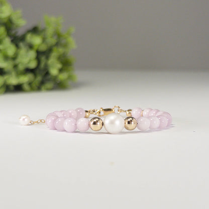 Kunzite, pearl and initial gold bracelet featuring translucent violet kunzite beads, lustrous freshwater pearls and a personalised gold-filled stamped initial disc.