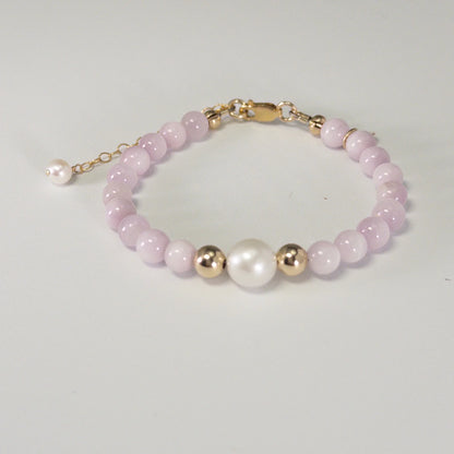 Kunzite, pearl and initial gold bracelet featuring translucent violet kunzite beads, lustrous freshwater pearls and a personalised gold-filled stamped initial disc.