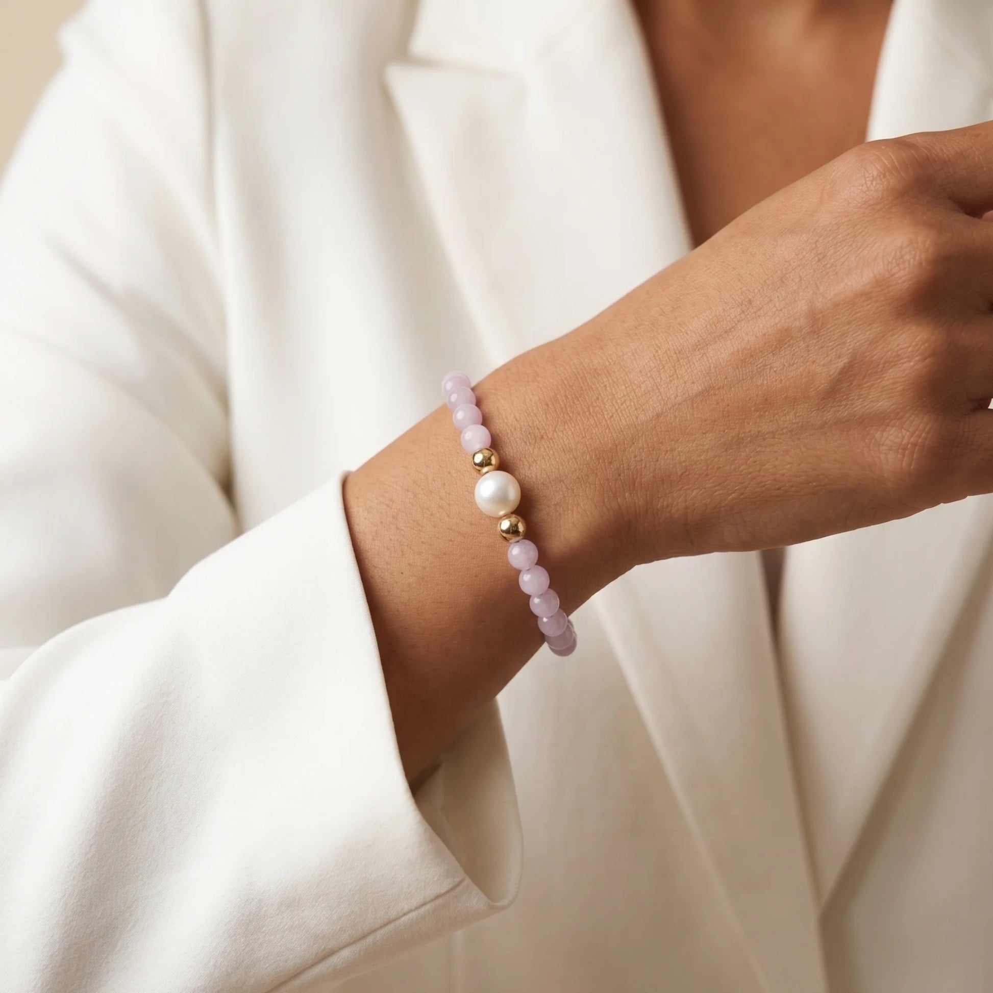 Kunzite, pearl and initial gold bracelet featuring translucent violet kunzite beads, lustrous freshwater pearls and a personalised gold-filled stamped initial disc.