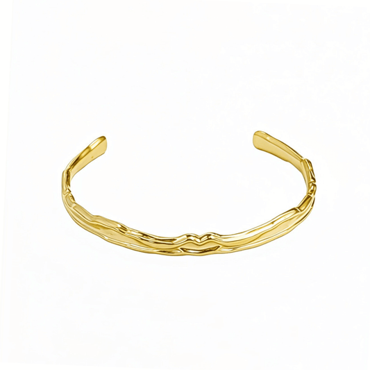 Gold textured cuff bracelet with molten, organic design.