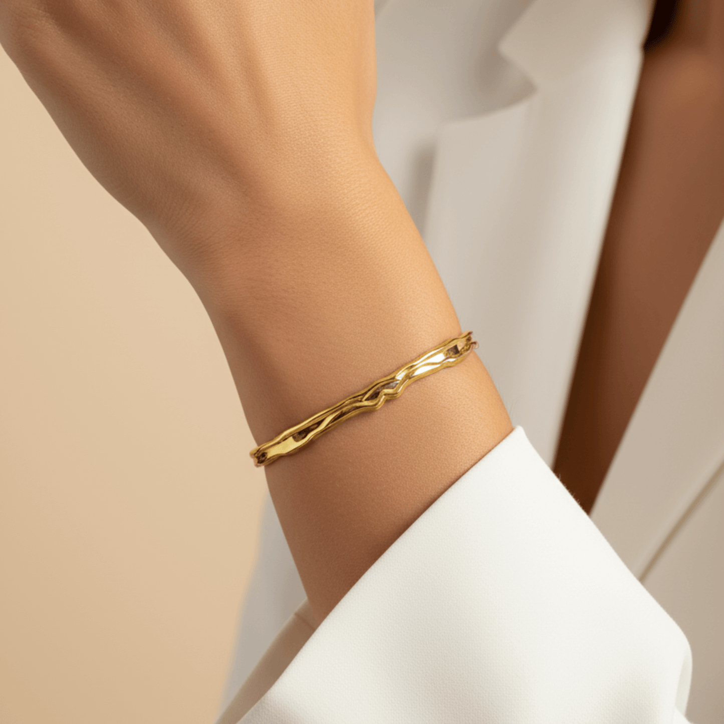 Gold textured cuff bracelet with molten, organic design.