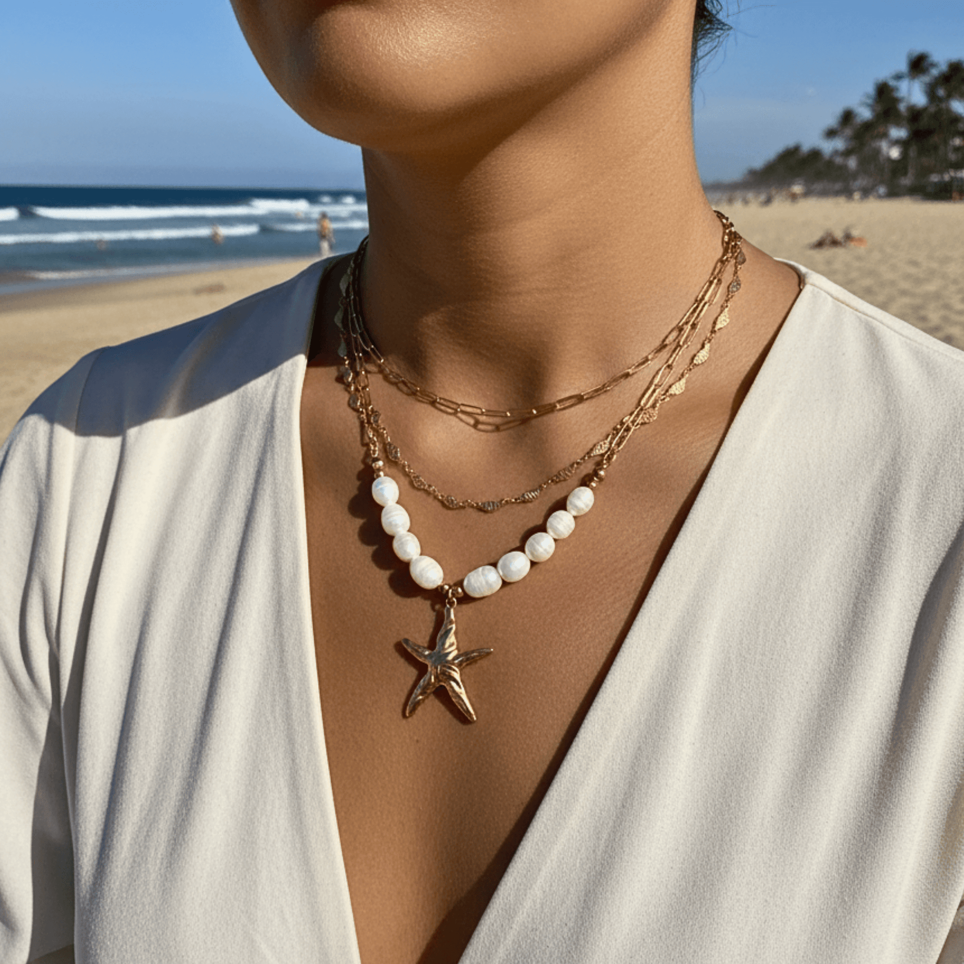 Elegant waterproof gold chain featuring textured leaf links with a minimalist, nature-inspired design