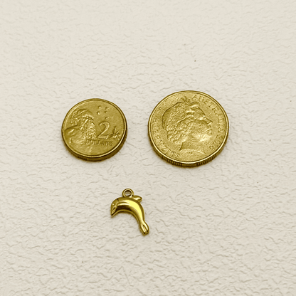 Gold dolphin charm in a leaping pose, ocean-themed PVD gold plated pendant