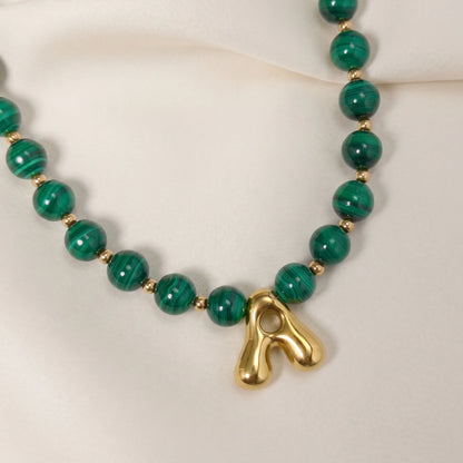 Malachite Gold Bubble Initial Necklace with polished green beads, gold spacers and a sculptural initial pendant.