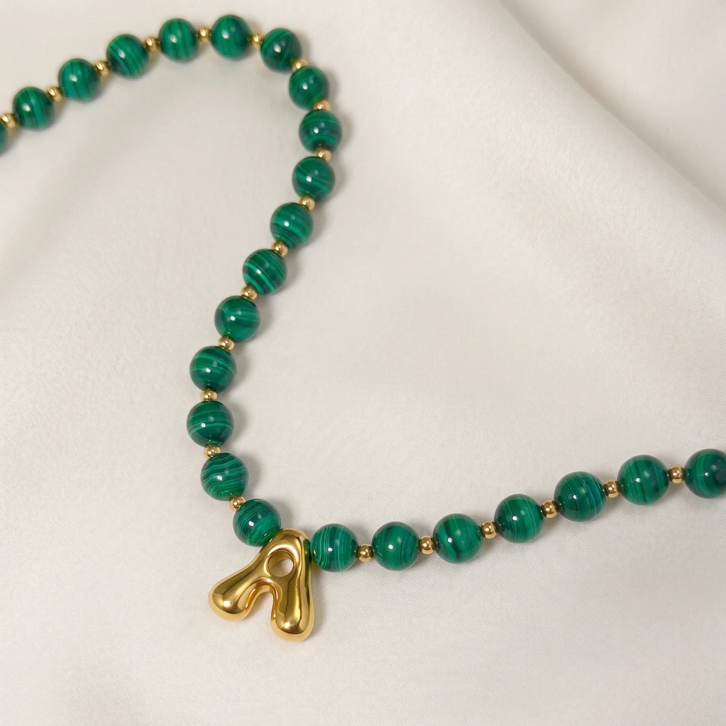 Malachite Gold Bubble Initial Necklace with polished green beads, gold spacers and a sculptural initial pendant.
