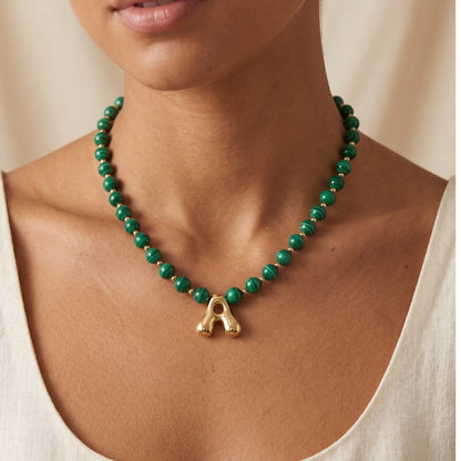 Malachite Gold Bubble Initial Necklace with polished green beads, gold spacers and a sculptural initial pendant.