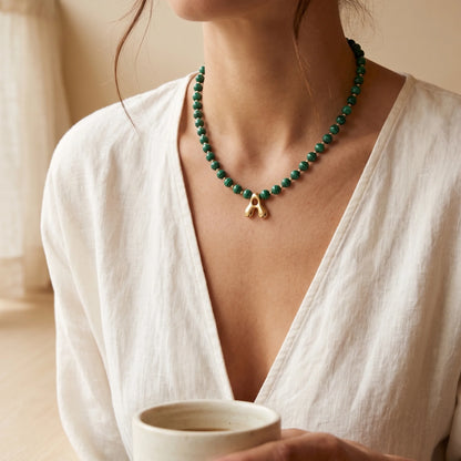 Malachite Gold Bubble Initial Necklace with polished green beads, gold spacers and a sculptural initial pendant.