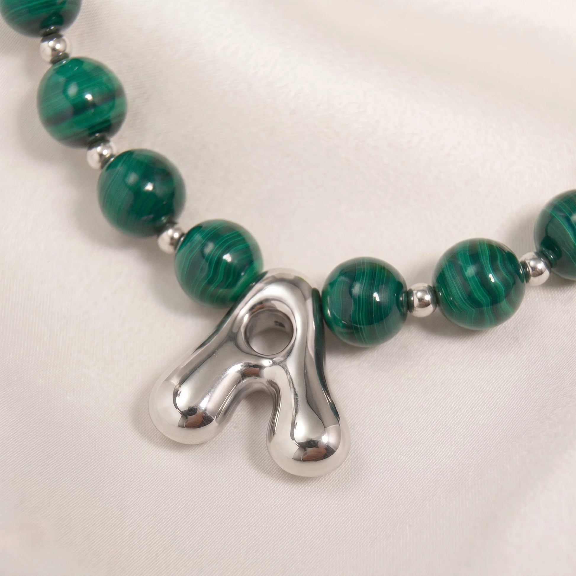 Malachite Gold Bubble Initial Necklace with polished green beads, gold spacers and a sculptural initial pendant.