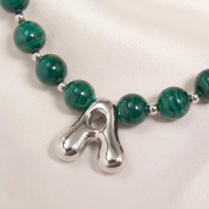 Malachite Gold Bubble Initial Necklace with polished green beads, gold spacers and a sculptural initial pendant.