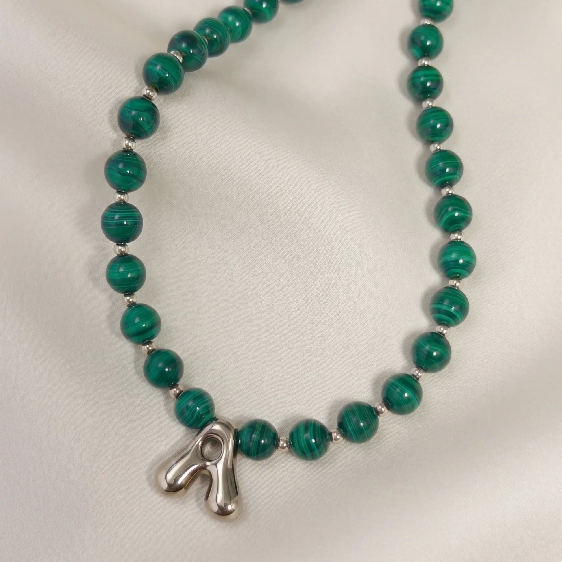 Malachite Gold Bubble Initial Necklace with polished green beads, gold spacers and a sculptural initial pendant.