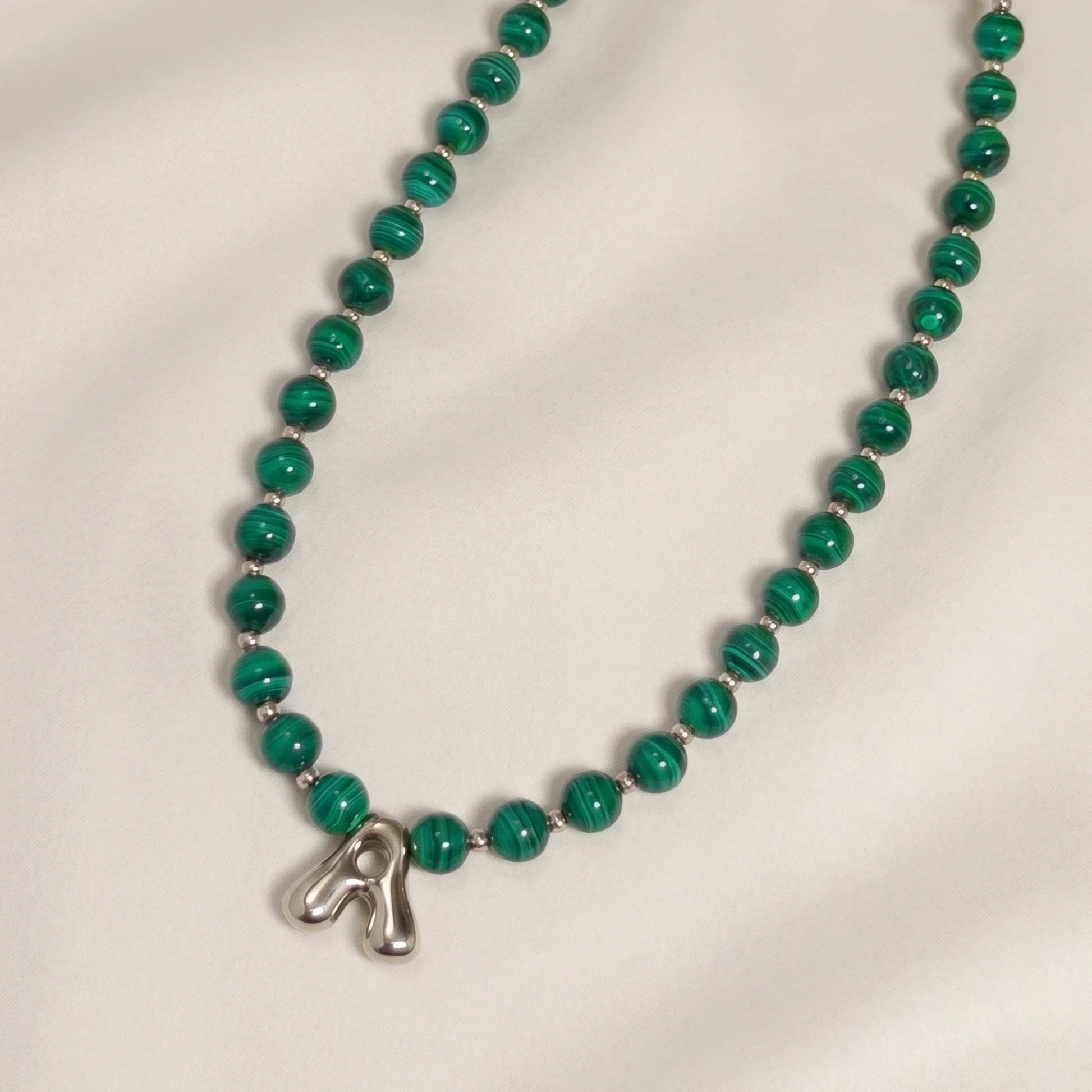 Malachite Gold Bubble Initial Necklace with polished green beads, gold spacers and a sculptural initial pendant.