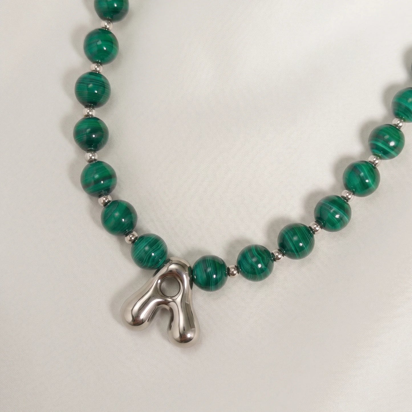 Malachite Gold Bubble Initial Necklace with polished green beads, gold spacers and a sculptural initial pendant.