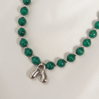 Malachite Gold Bubble Initial Necklace with polished green beads, gold spacers and a sculptural initial pendant.