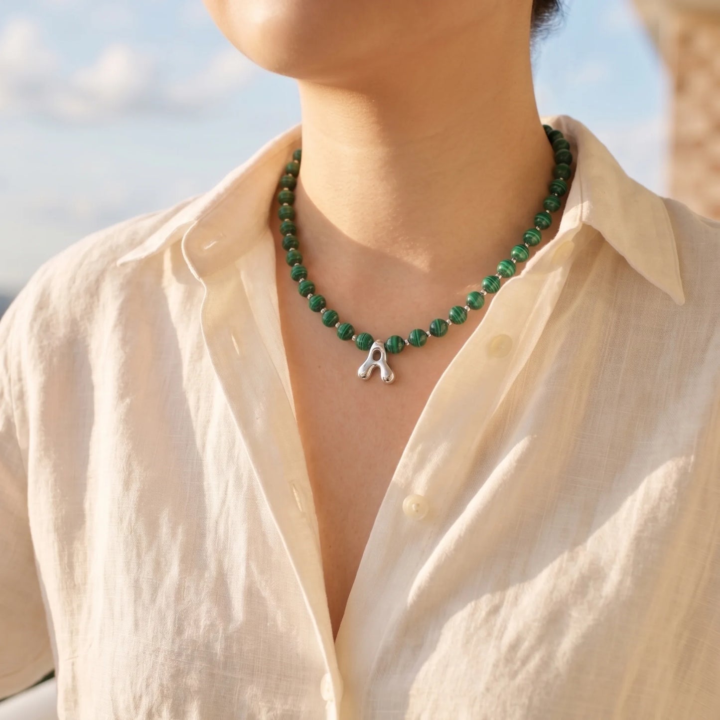 Malachite Gold Bubble Initial Necklace with polished green beads, gold spacers and a sculptural initial pendant.