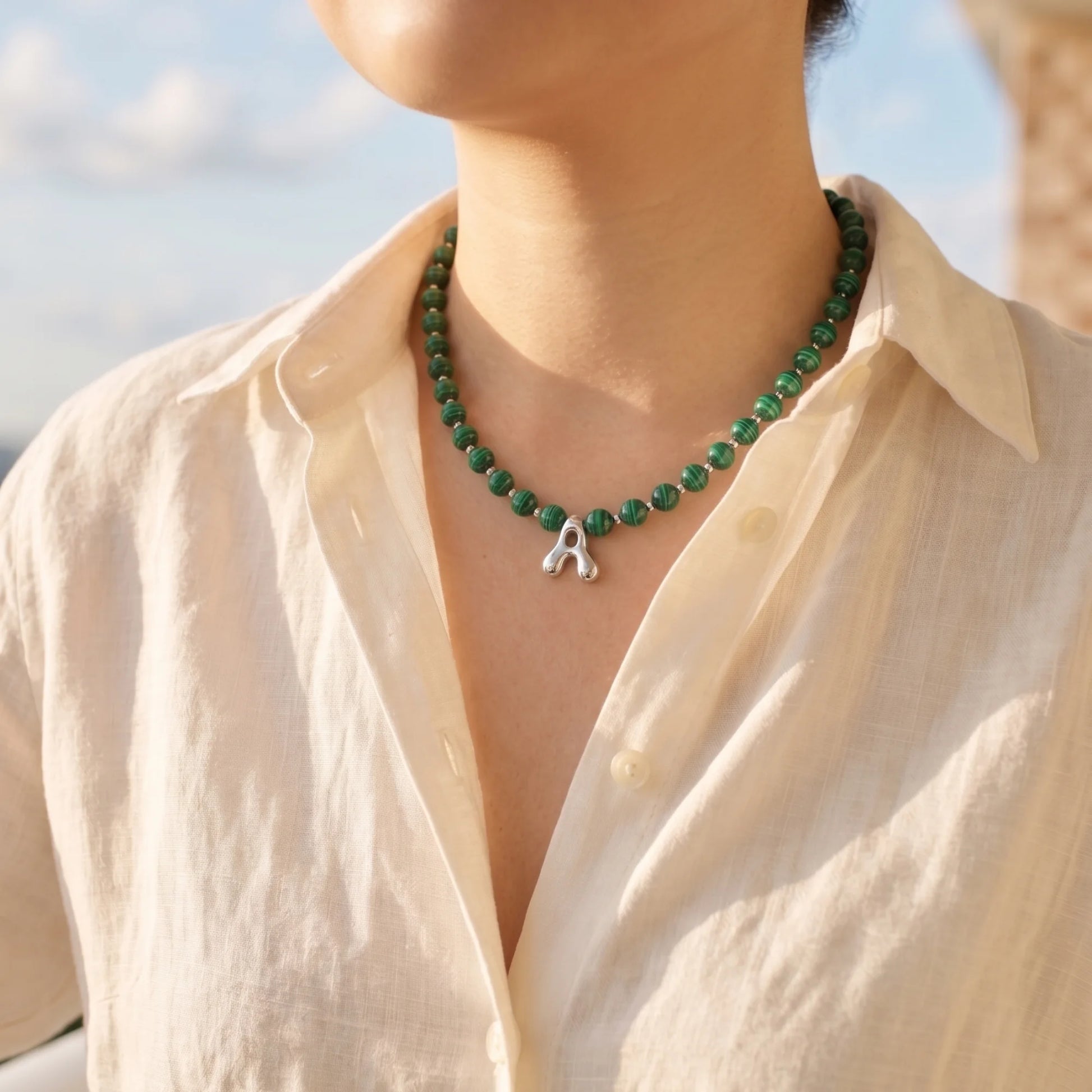 Malachite Gold Bubble Initial Necklace with polished green beads, gold spacers and a sculptural initial pendant.