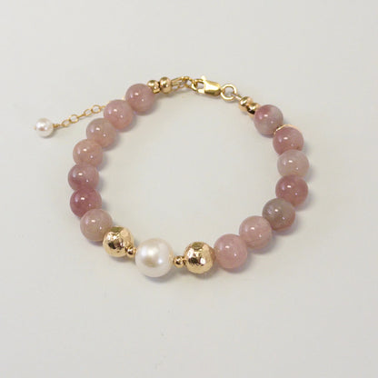 A beaded bracelet featuring mauve rose quartz, premium freshwater pearl, and stamped initial disc. 14k gold filled. MXW Jewellery