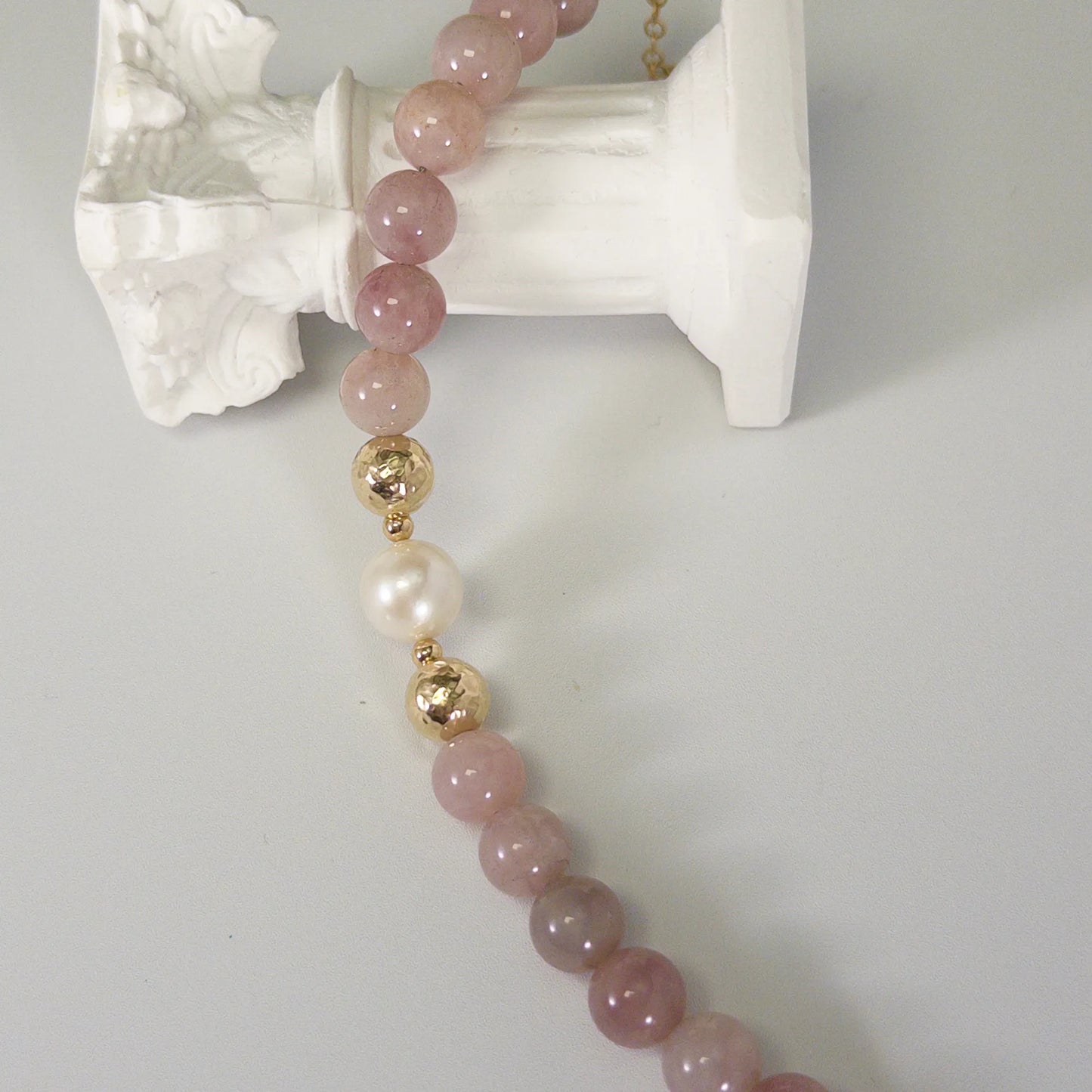 A beaded bracelet featuring mauve rose quartz, premium freshwater pearl, and stamped initial disc. 14k gold filled. MXW Jewellery