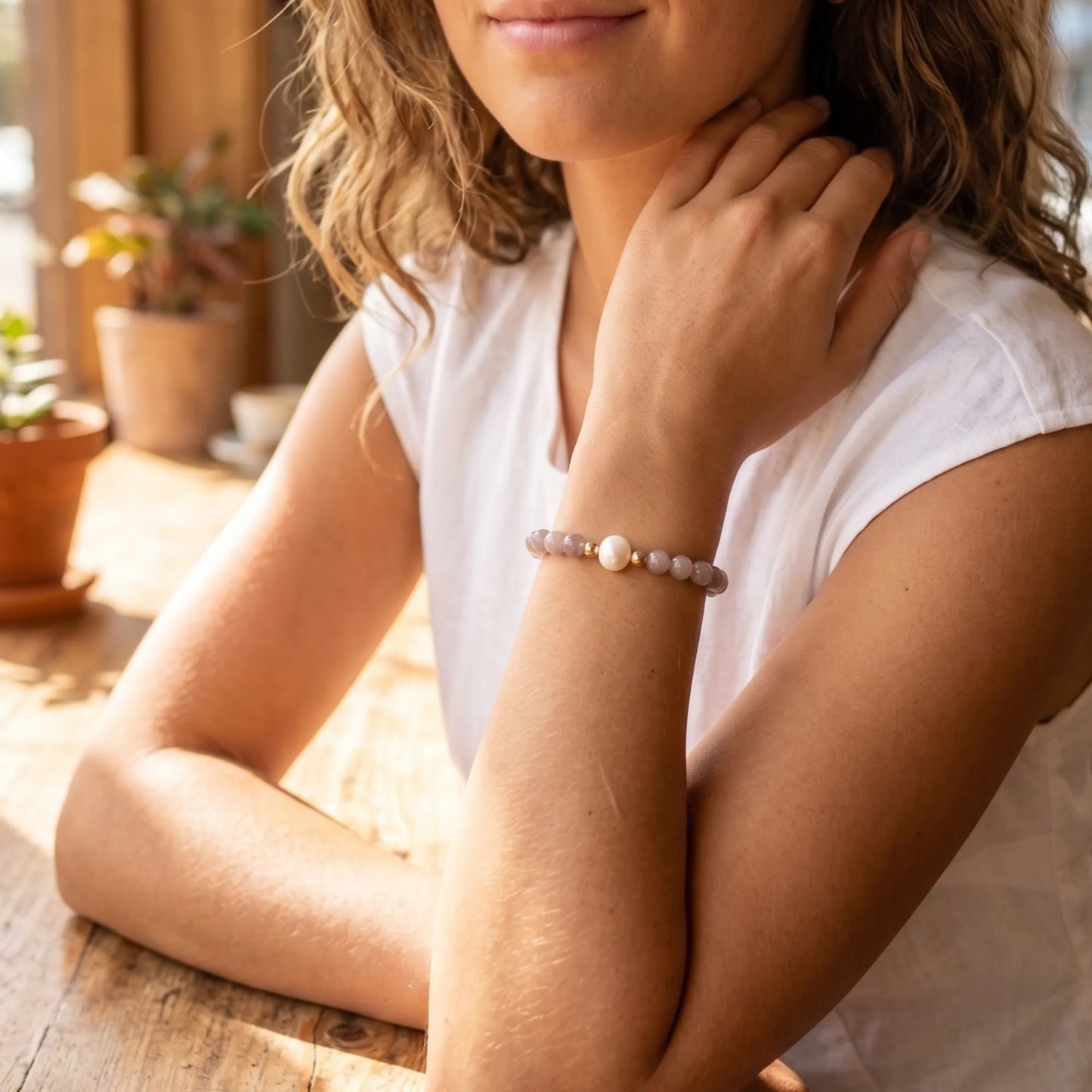 A beaded bracelet featuring mauve rose quartz, premium freshwater pearl, and stamped initial disc. 14k gold filled. MXW Jewellery