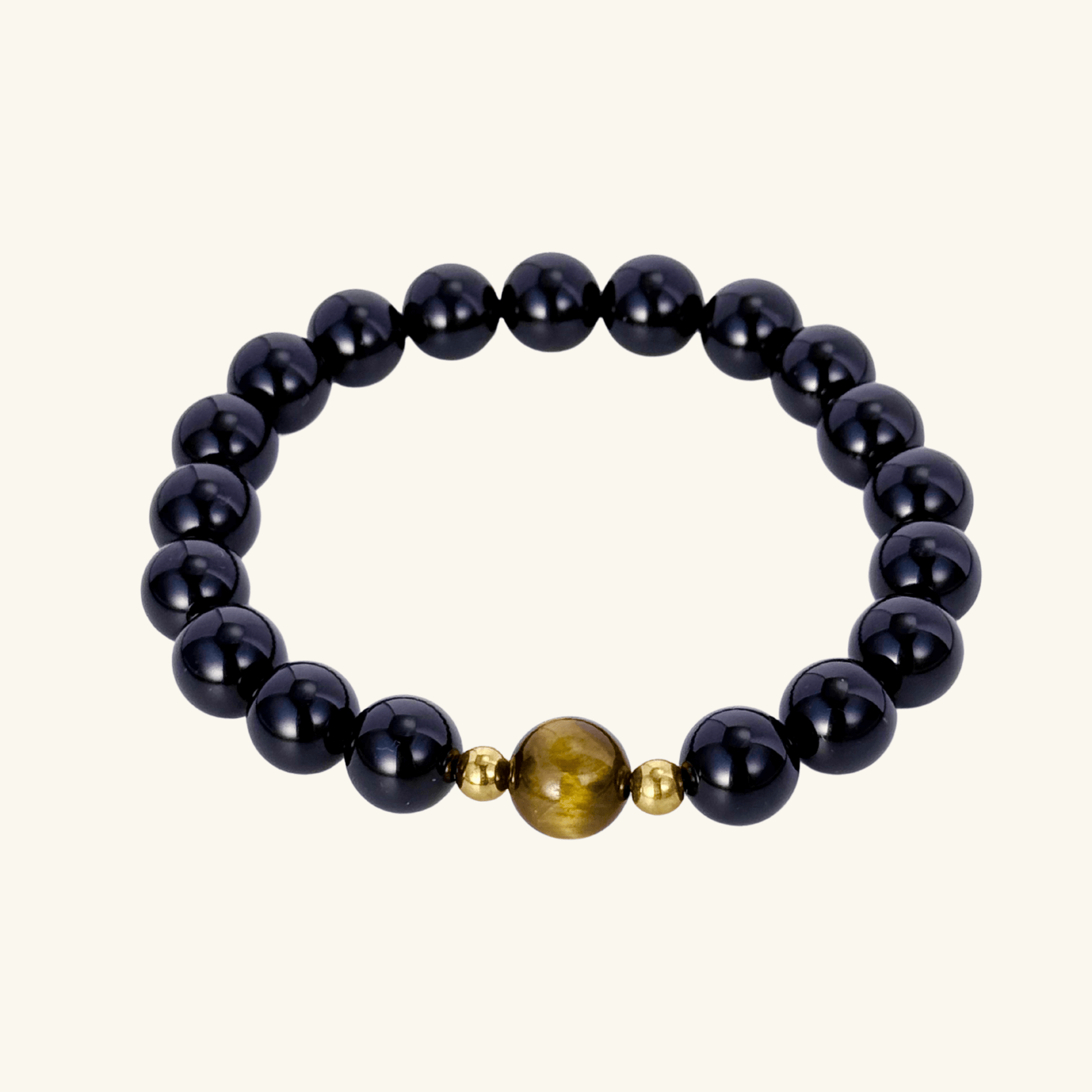 Men’s bracelet with polished black agate beads, single tiger’s eye gemstone, and gold accents on stretch cord.