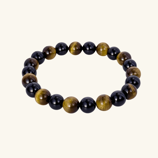 Handmade men’s bracelet with round black agate and tiger’s eye gemstone beads on elastic cord.