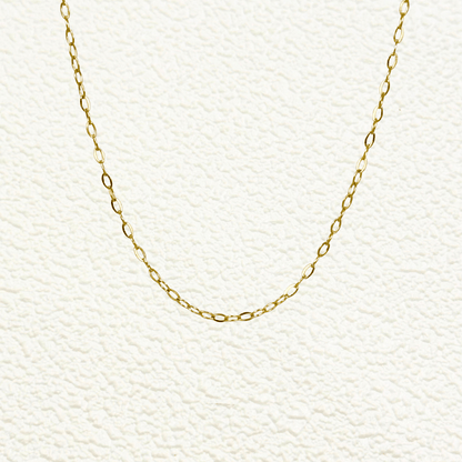 Mini paperclip link chain in 18K gold-plated stainless steel with fine elongated oval links, waterproof and tarnish-resistant, ideal for minimalist layering or adding custom charms
