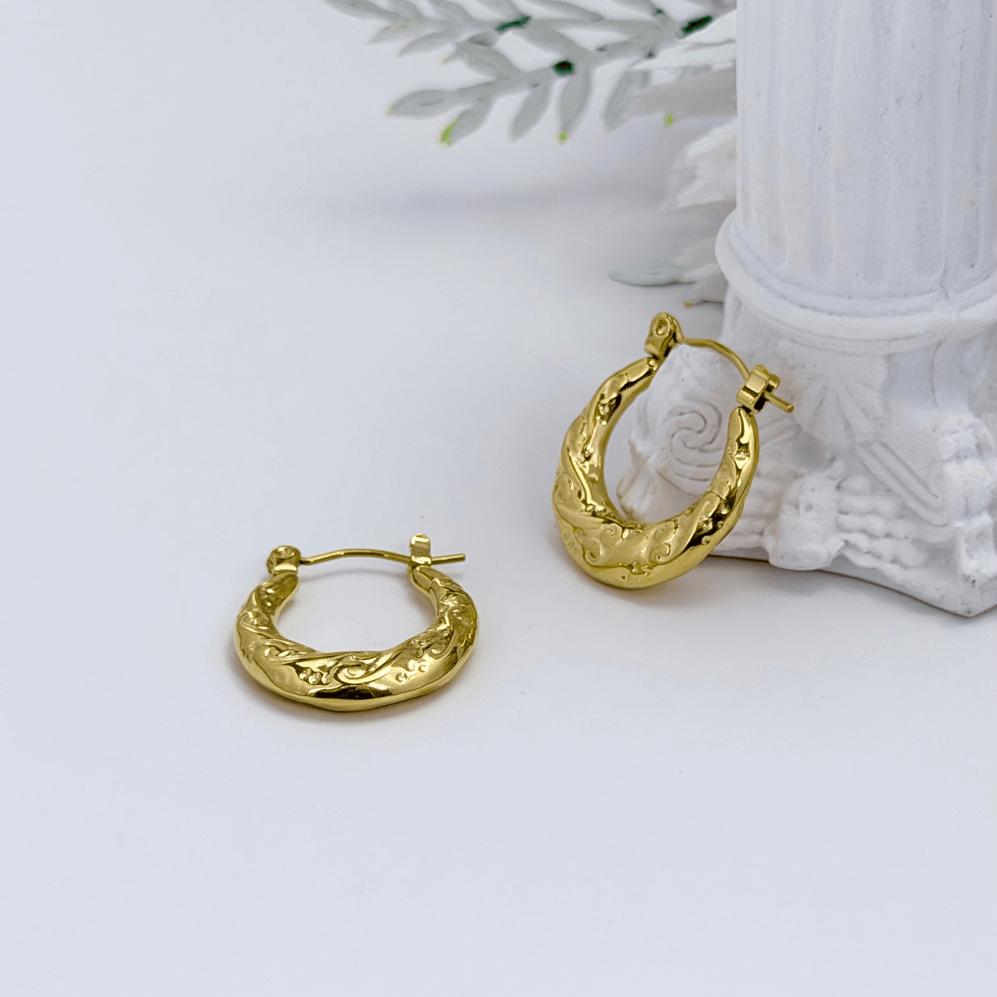 Molten Swirl Gold Hoop Earrings on white background