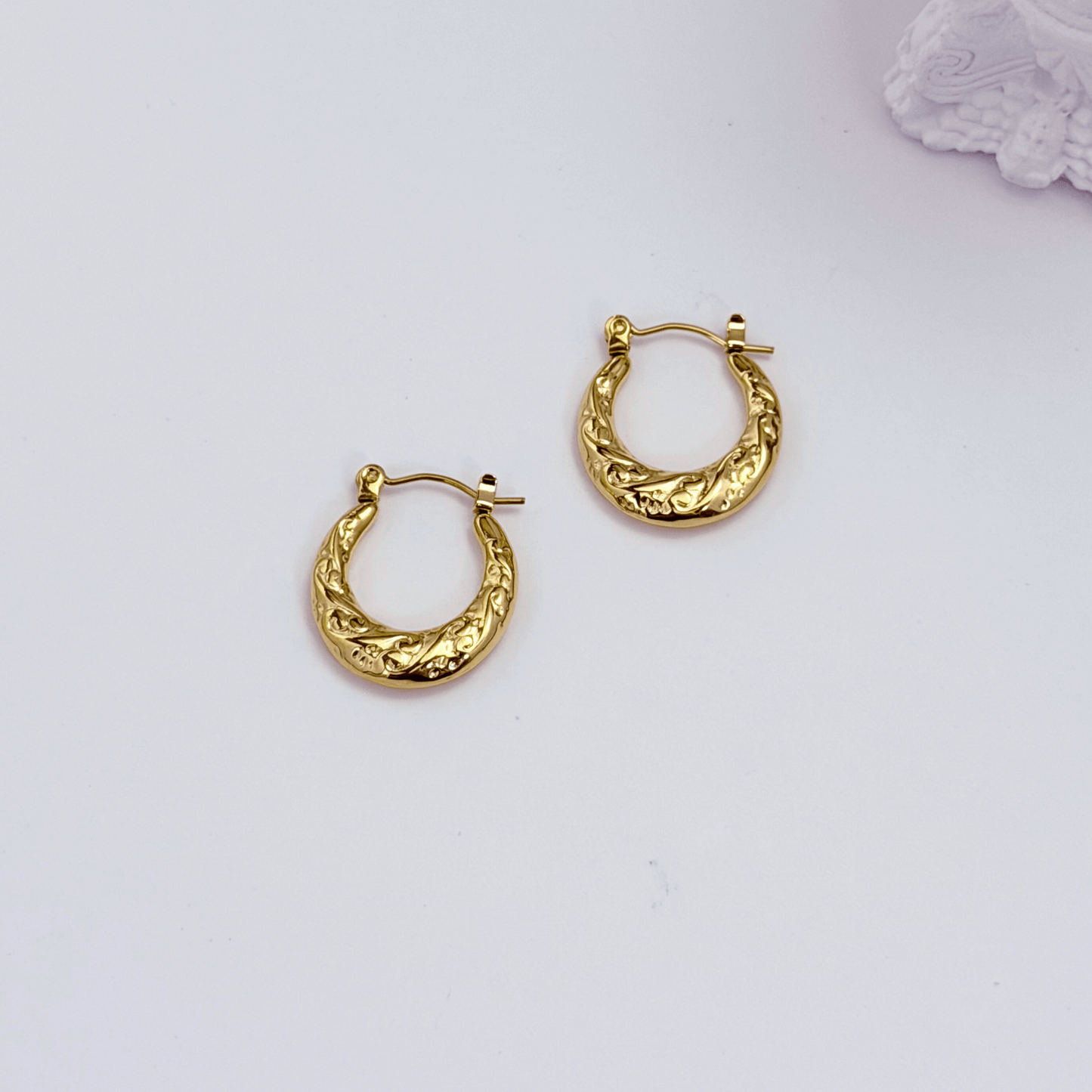 Molten Swirl Gold Hoop Earrings on white background