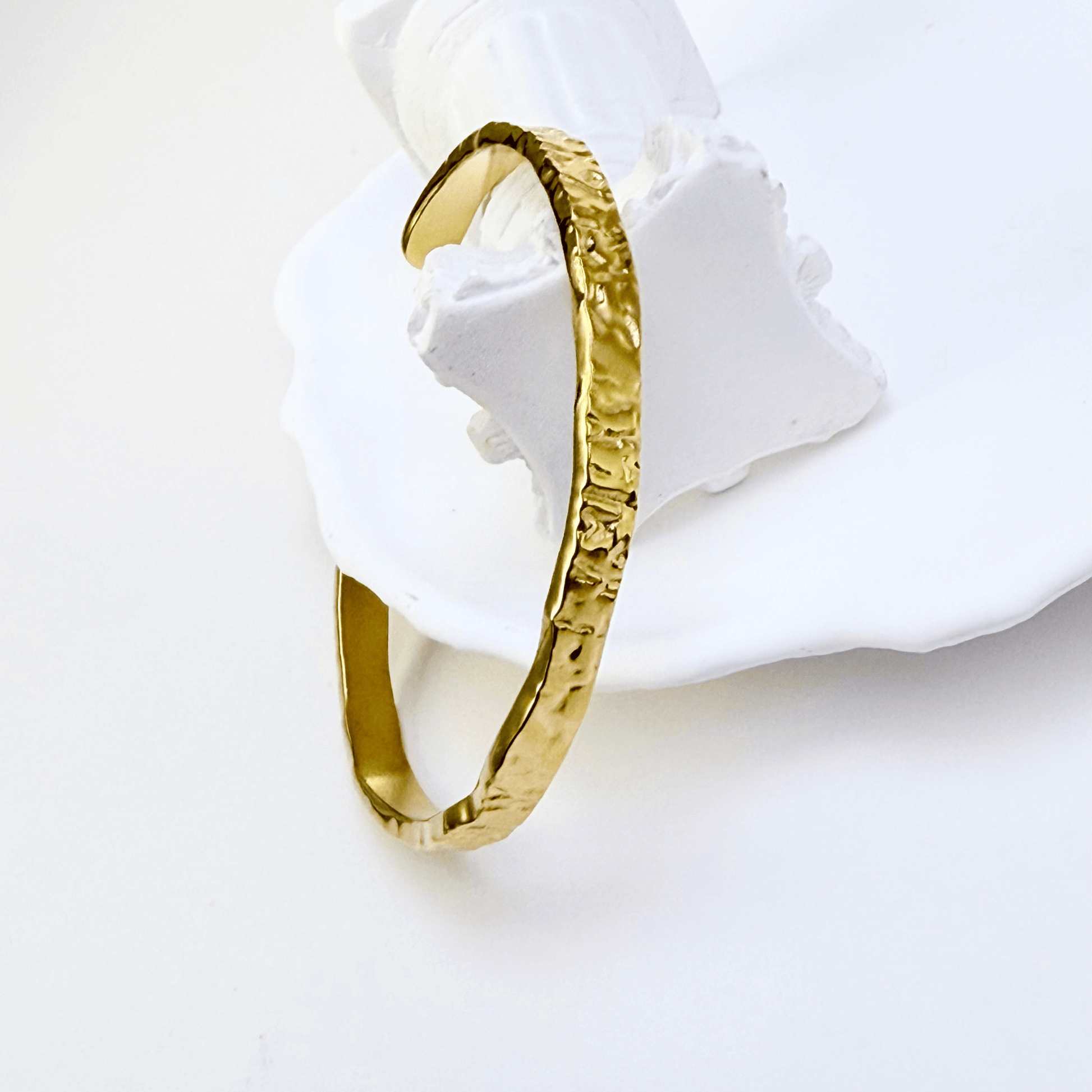 gold molten wave cuff bracelet with textured finish, adjustable and elegant design