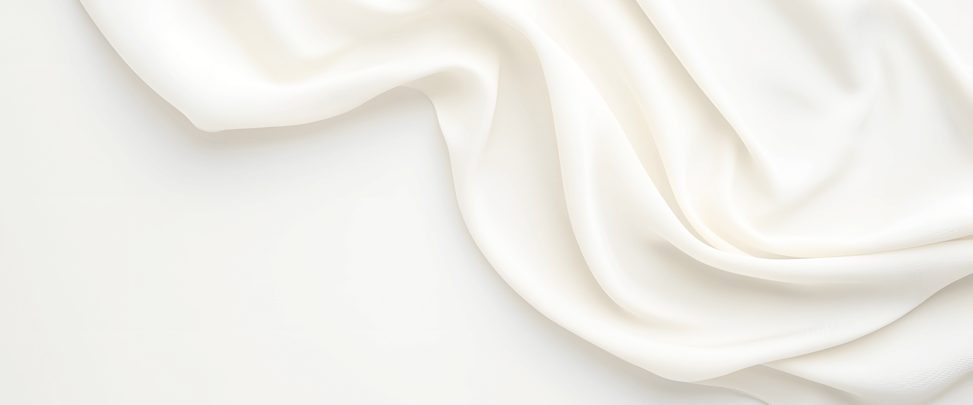 Soft cream fabric background representing MXW Jewellery’s “Wear What You Feel” section, symbolising elegance and self-expression.
