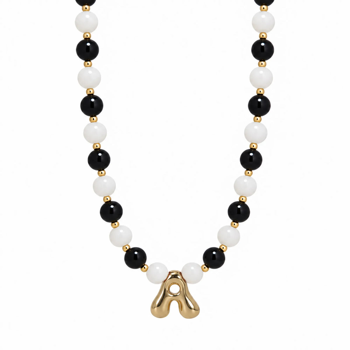 14K gold filled necklace with alternating black onyx and white mother-of-pearl beads, gold spacers and bubble initial letter
