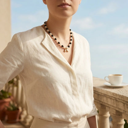 14K gold filled necklace with alternating black onyx and white mother-of-pearl beads, gold spacers and bubble initial letter