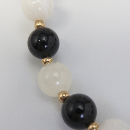 14K gold filled necklace with alternating black onyx and white mother-of-pearl beads, gold spacers and bubble initial letter