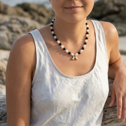 14K gold filled necklace with alternating black onyx and white mother-of-pearl beads, gold spacers and bubble initial letter