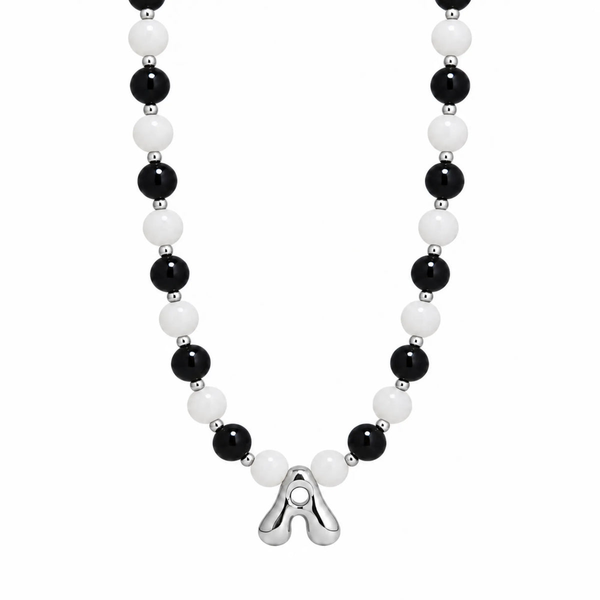 personalised sterling silver necklace with alternating black onyx and white mother-of-pearl bead, gold spacers and bubble initial