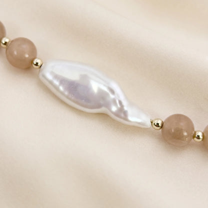 Orange moonstone necklace with 14K gold-filled beads and a baroque freshwater pearl