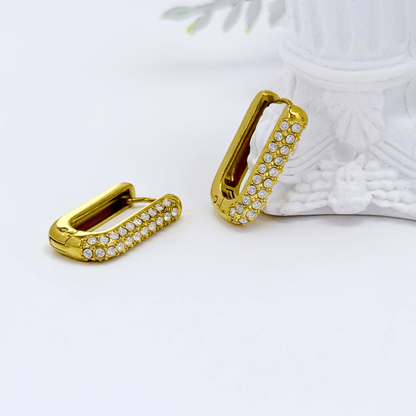 Pavé rectangular gold huggie earrings with modern geometric shape.