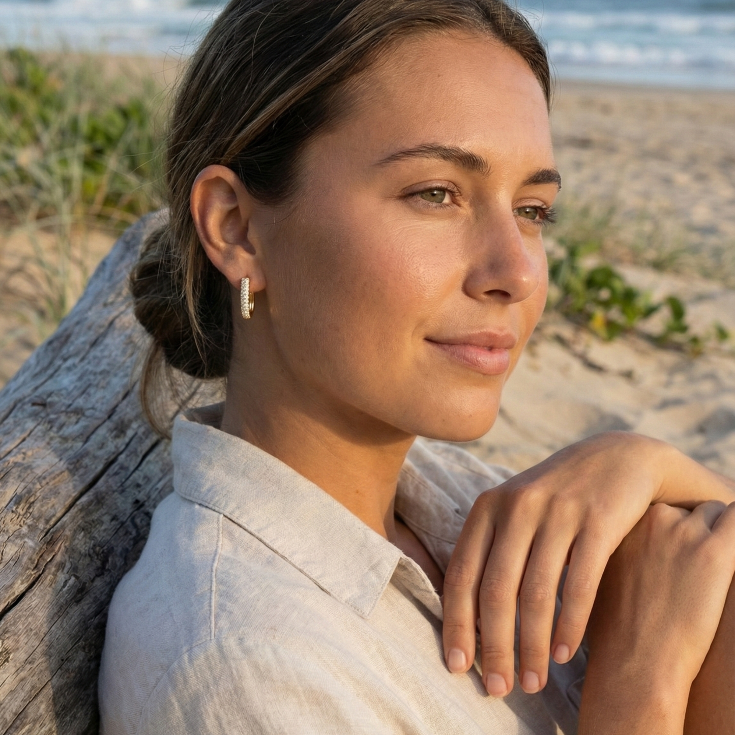 Pavé rectangular gold huggie earrings with modern geometric shape.