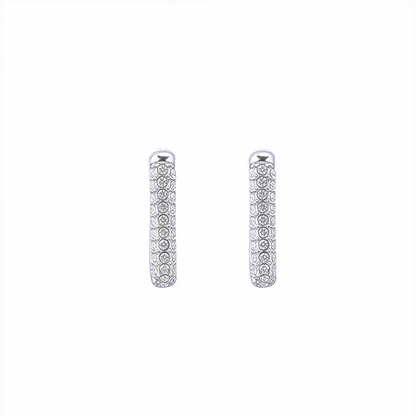 Pavé rectangular silver huggie earrings with crystal detailing.