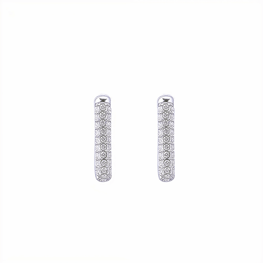 Pavé rectangular silver huggie earrings with crystal detailing.