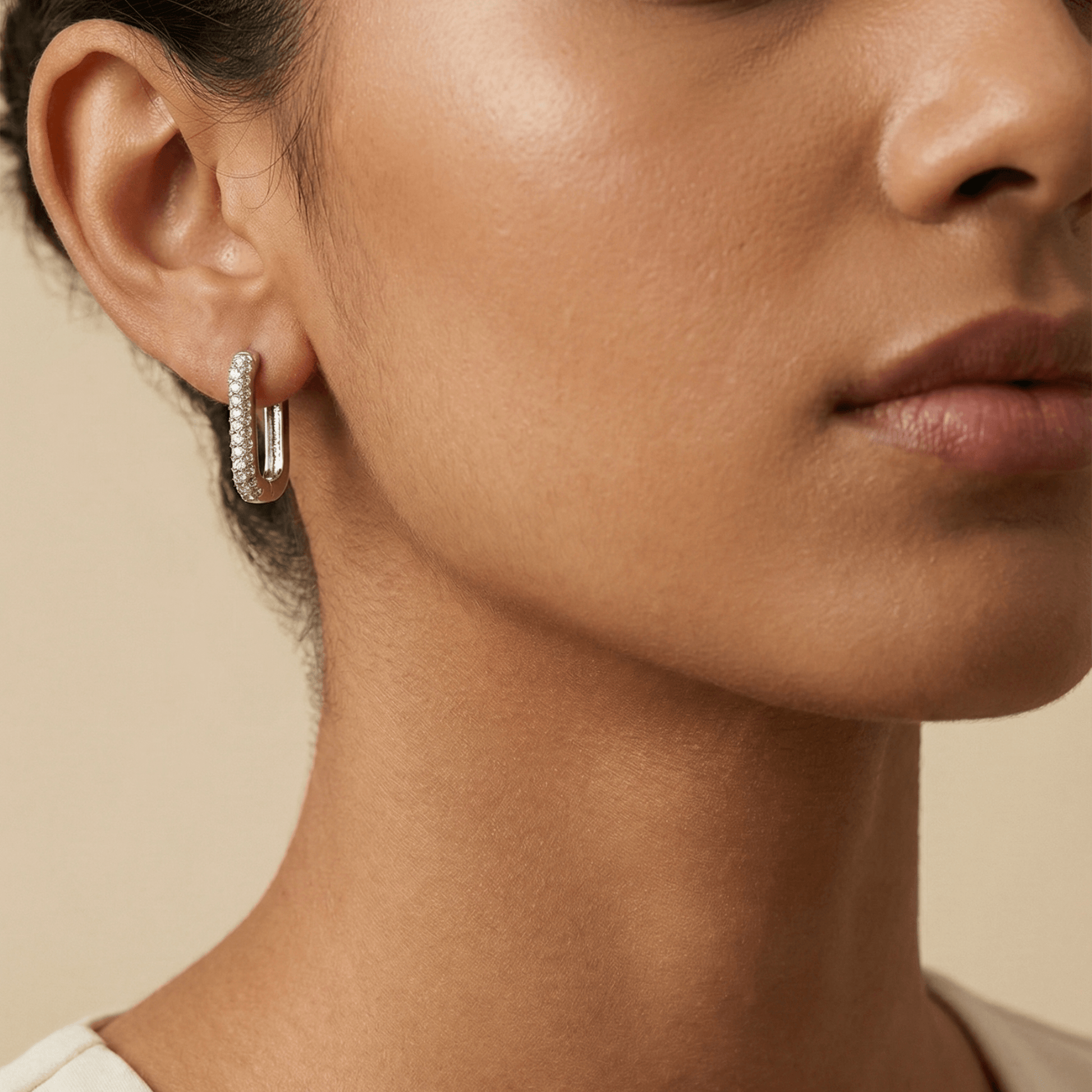 Pavé rectangular silver huggie earrings with crystal detailing.