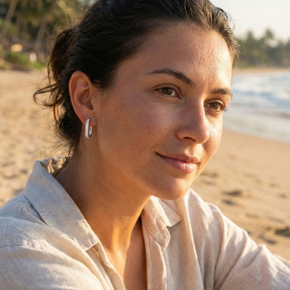 Pavé rectangular silver huggie earrings with crystal detailing.