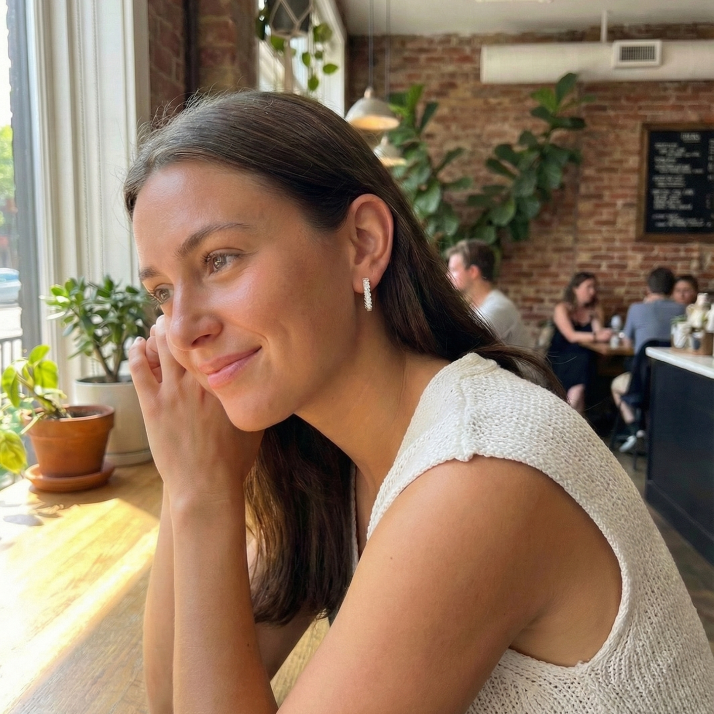 Pavé rectangular silver huggie earrings with crystal detailing.