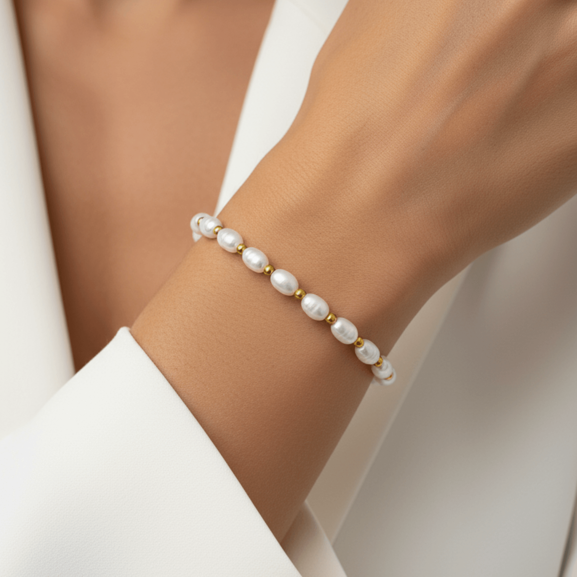 Pearl and Gold Bracelet with freshwater pearls and gold beads on stretch cord by MXW Jewellery