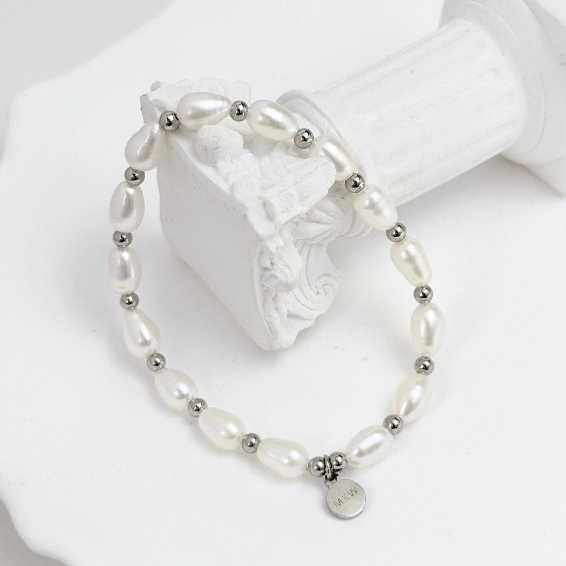 Pearl & Silver Bracelet with freshwater pearls and silver beads on stretch cord by MXW Jewellery
