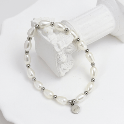 Pearl & Silver Bracelet with freshwater pearls and silver beads on stretch cord by MXW Jewellery