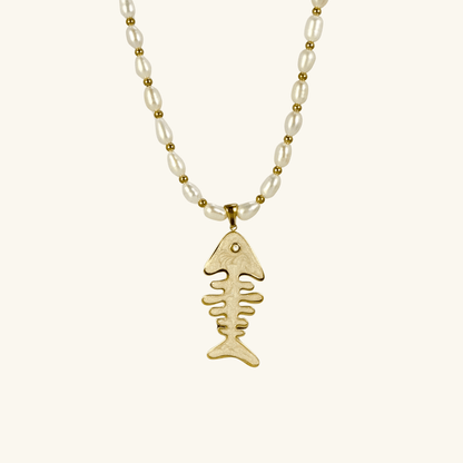 Pearl and gold fishbone necklace symbolizing resilience and good fortune