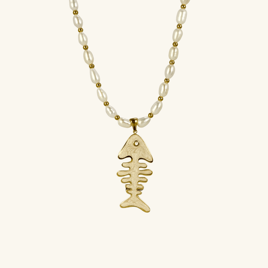 Pearl and gold fishbone necklace symbolizing resilience and good fortune