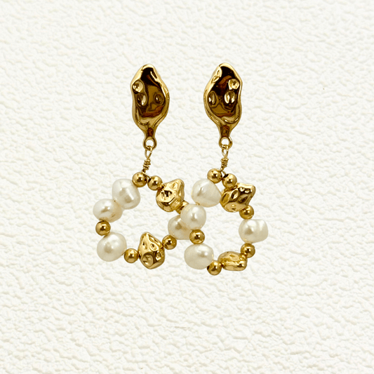 orbit drop earrings with freshwater pearls and molten gold beads in circular design