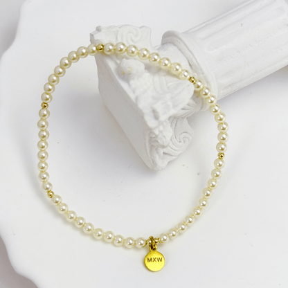 Delicate gold bracelet with Swarovski crystal pearls and gold accents